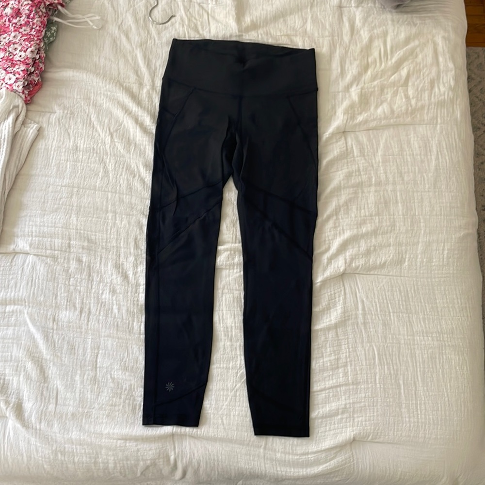 Black athleta leggings with mesh details goes down to right above ankles